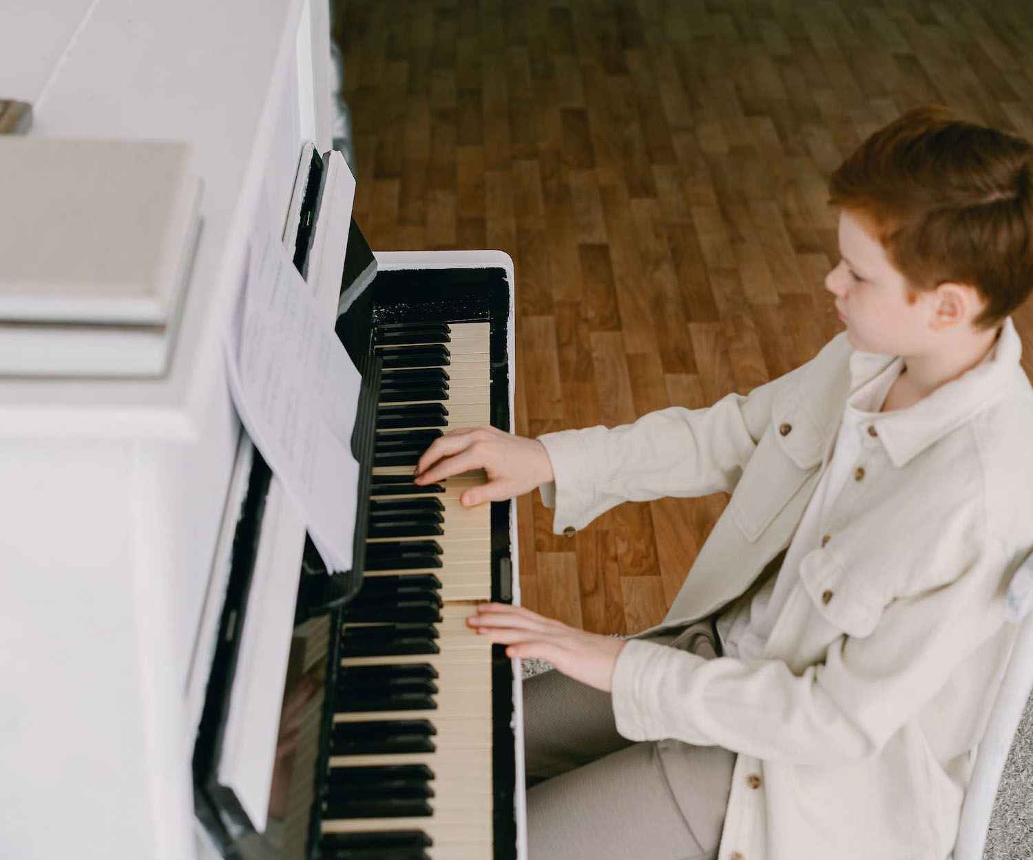 Young Cute Boy Playing Piano